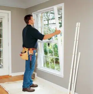 Man installing window