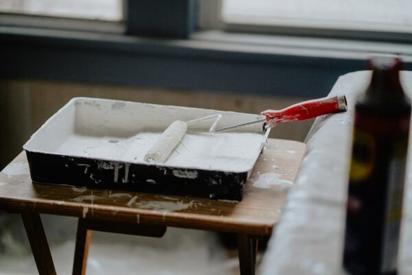 Paint roller in white paint