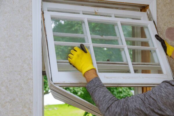 Someone installing a window