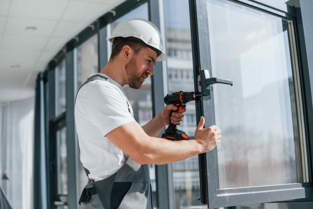 Man installing window