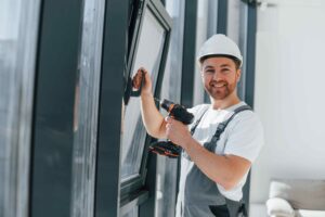 Man installing window