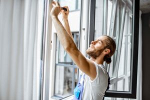 Workman adjusting window