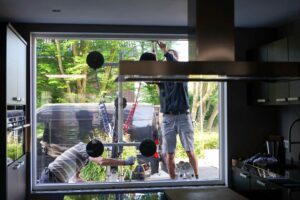 Men installing window