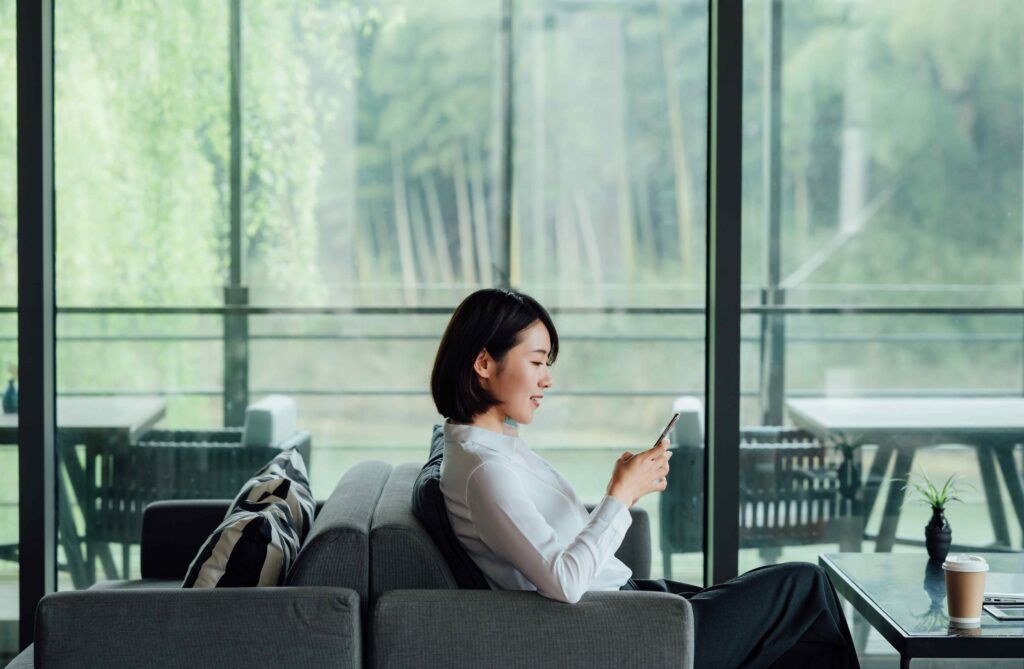 Businesswoman in front of window