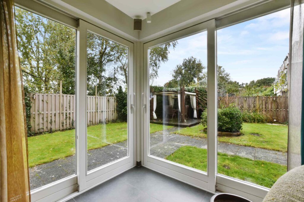 Big glass doors leading to a courtyard