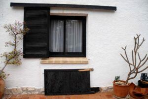 Window with storm shutters