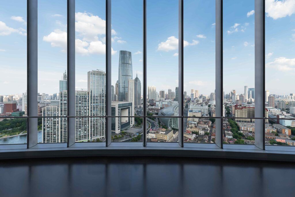 Large windows showing a cityscape