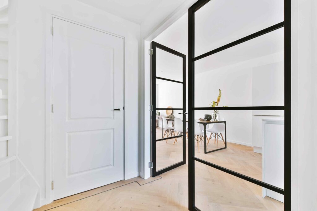 Stylish glass door in corridor