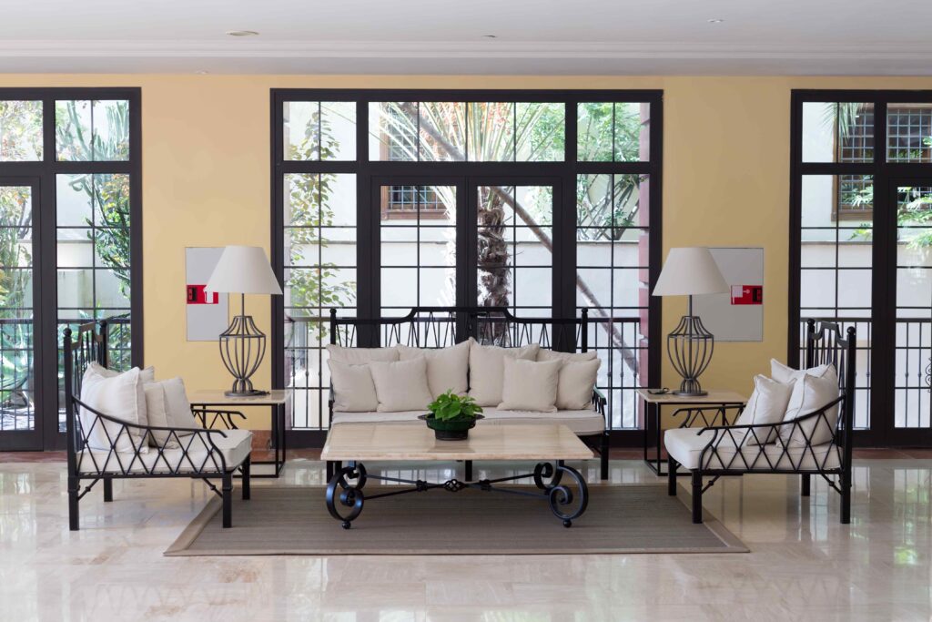 Furniture in front of a wrought iron window
