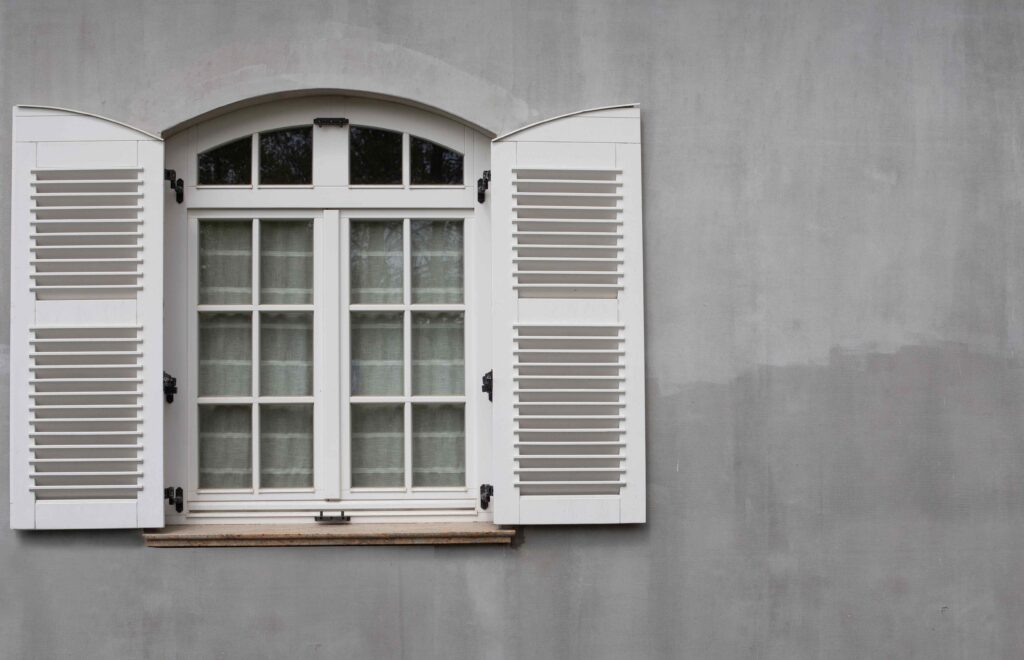 Window with storm shutters